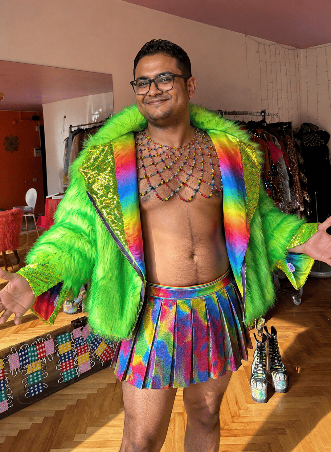 Portrait of the site host in a bright rainbow outfit